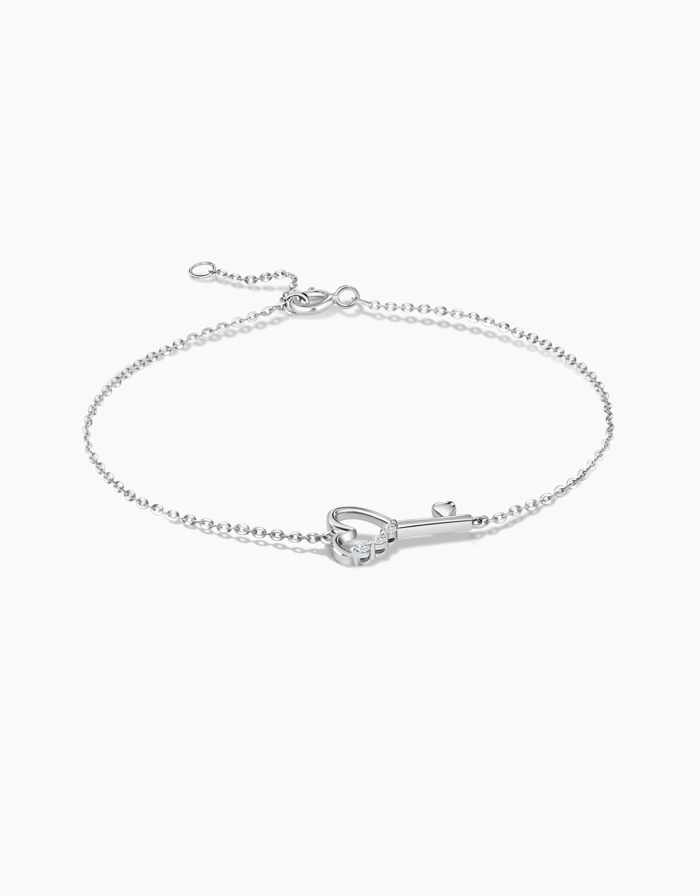 LVC diamond bracelet in white gold with a heart key charm 