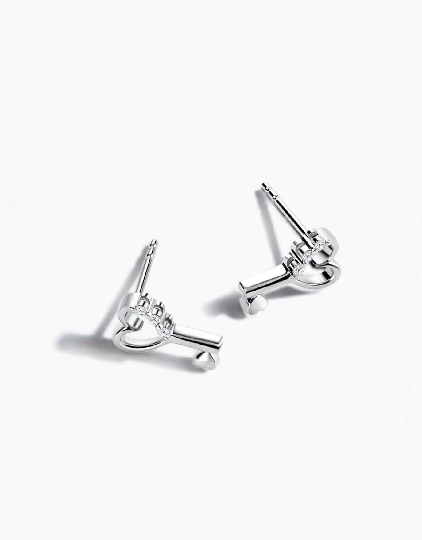 LVC diamond earrings with a heart key design in white gold