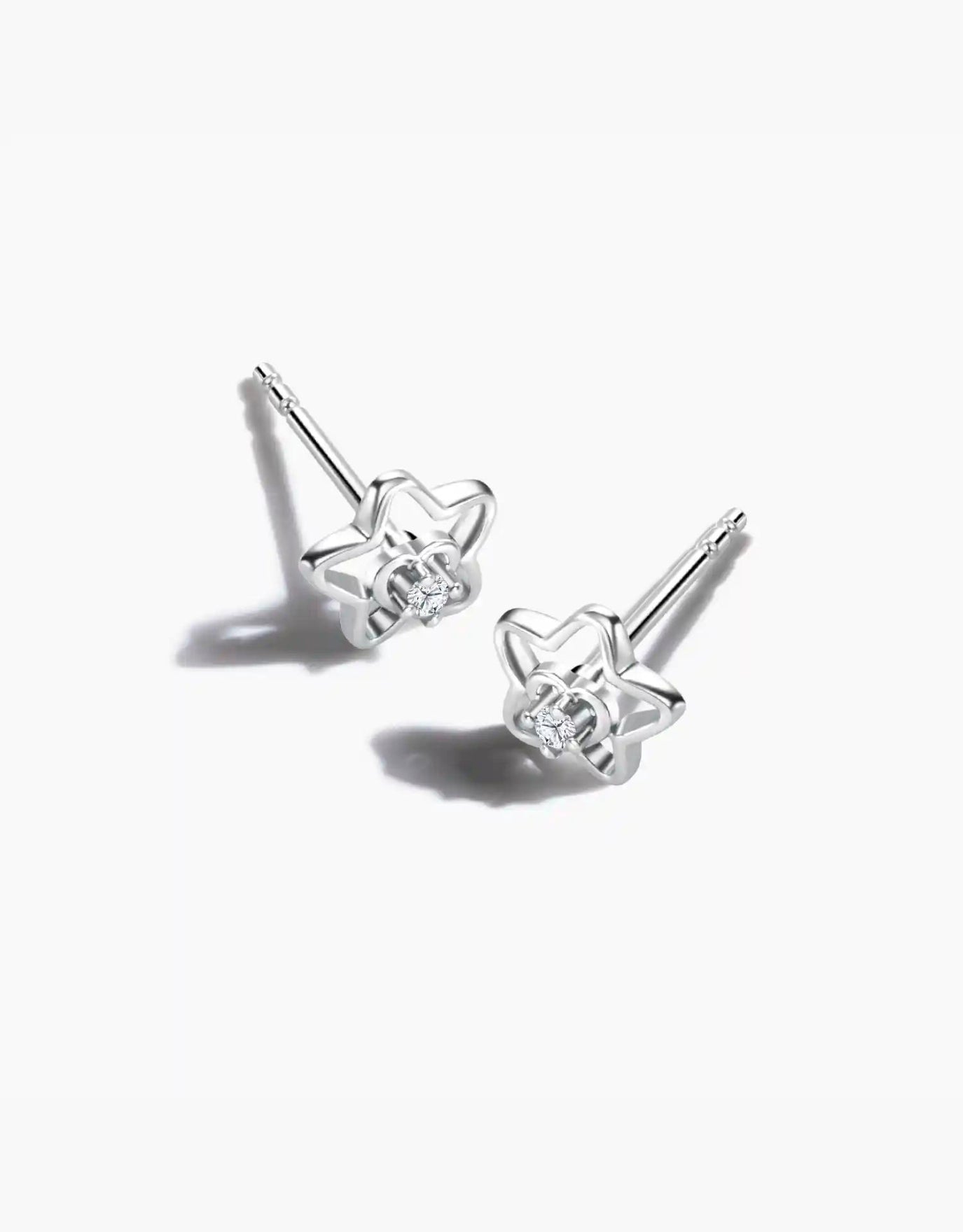 LVC diamond earrings with an outline of a star design and a heart inside in white gold