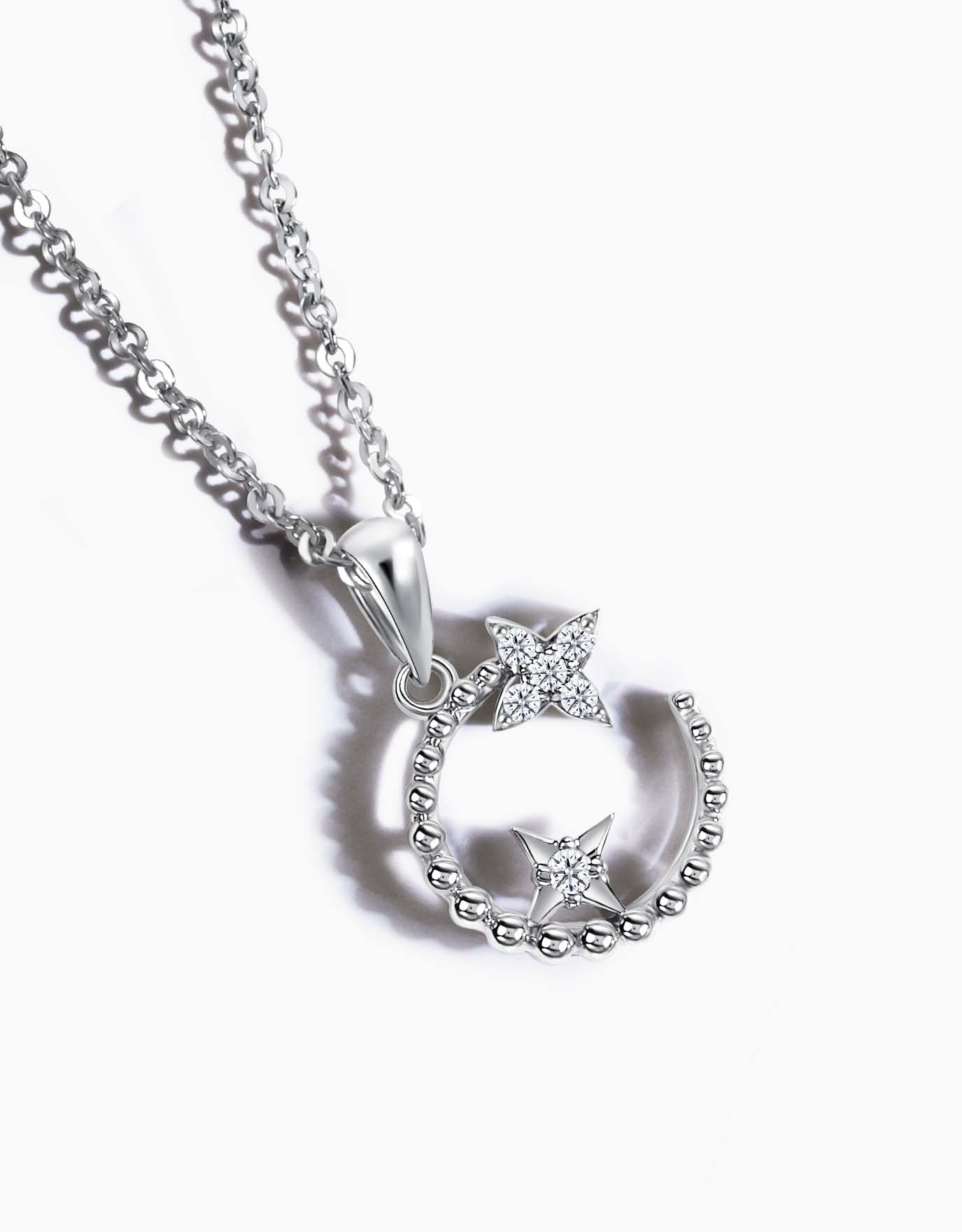 LVC necklace in white gold featuring a crescent moon and stars