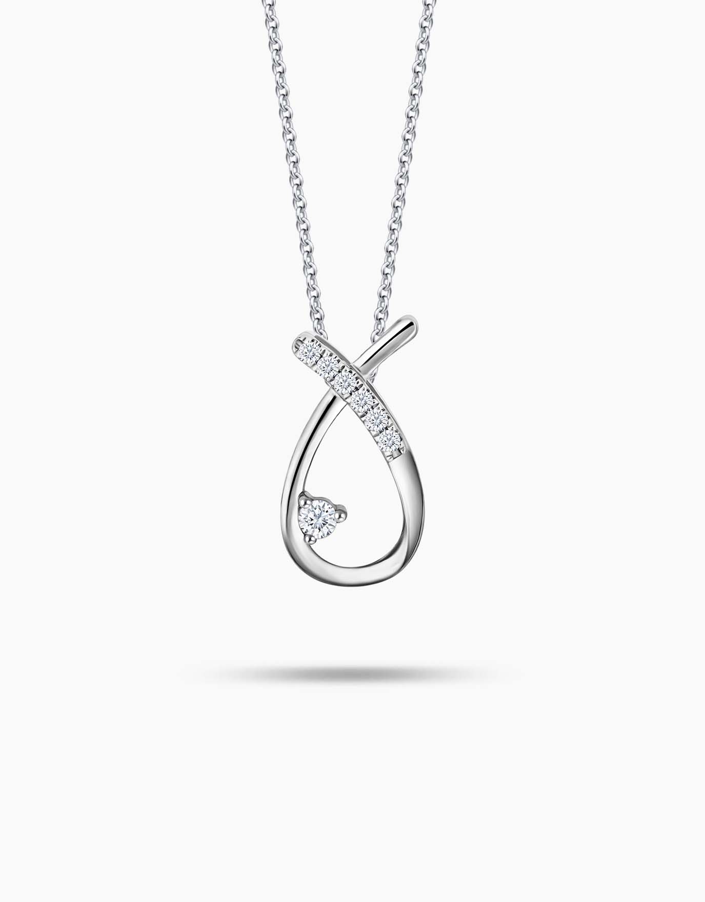 LVC necklace in white gold with the shape of a crossed horseshoe pendant encrusted with diamonds