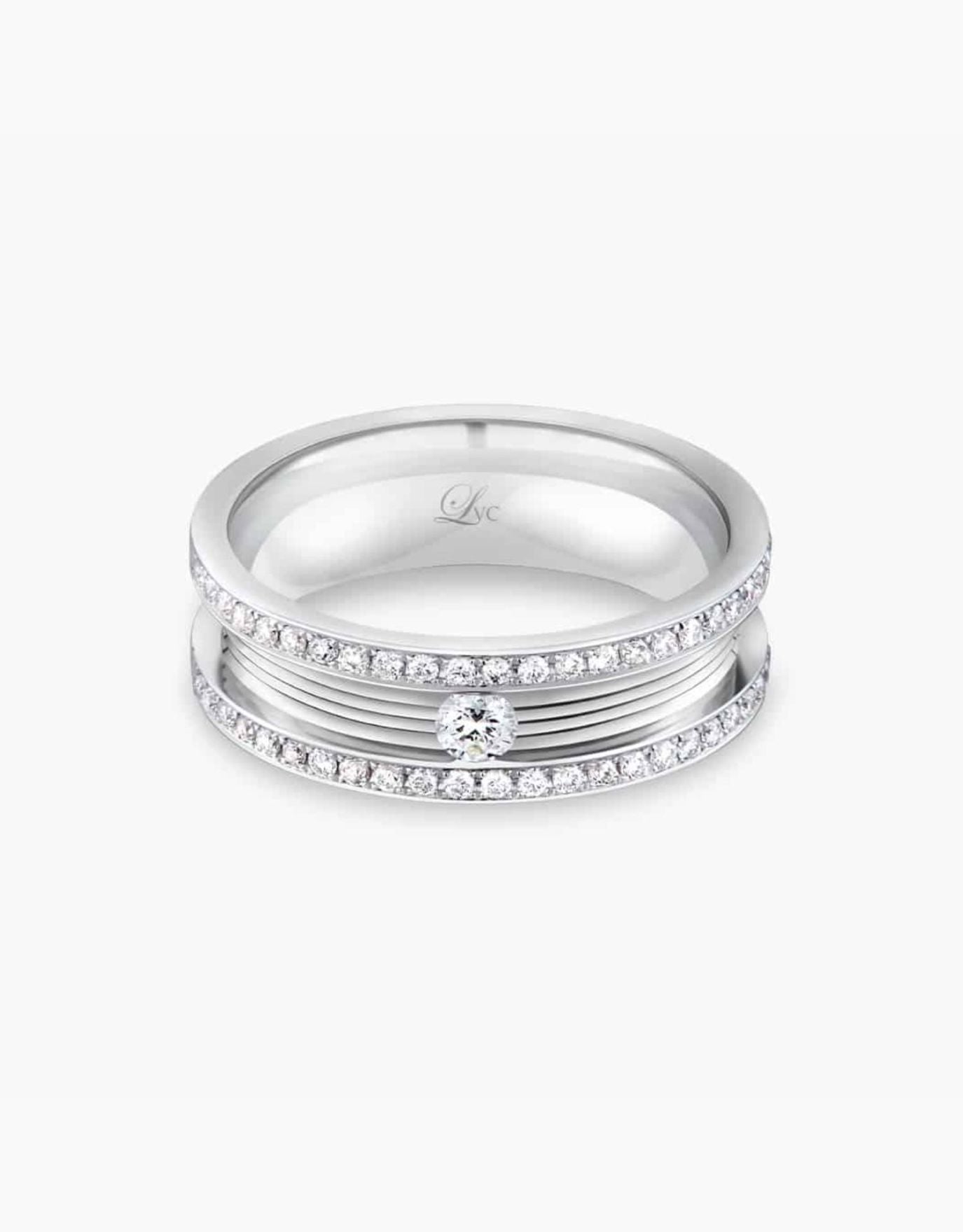 LVC wedding band in white gold topped with a center diamond stone and finished with full round side diamonds