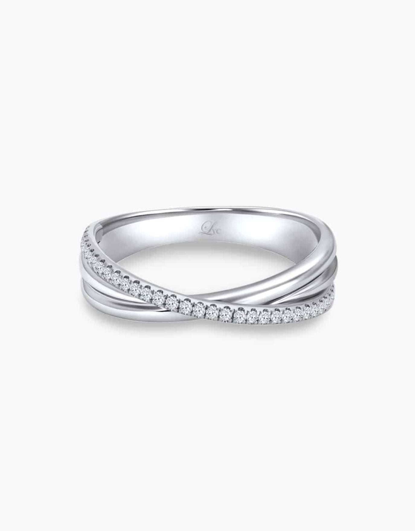 LVC wedding band in white gold designed with an intertwining of bands fitted with a row of stunning diamonds that runs across the ring