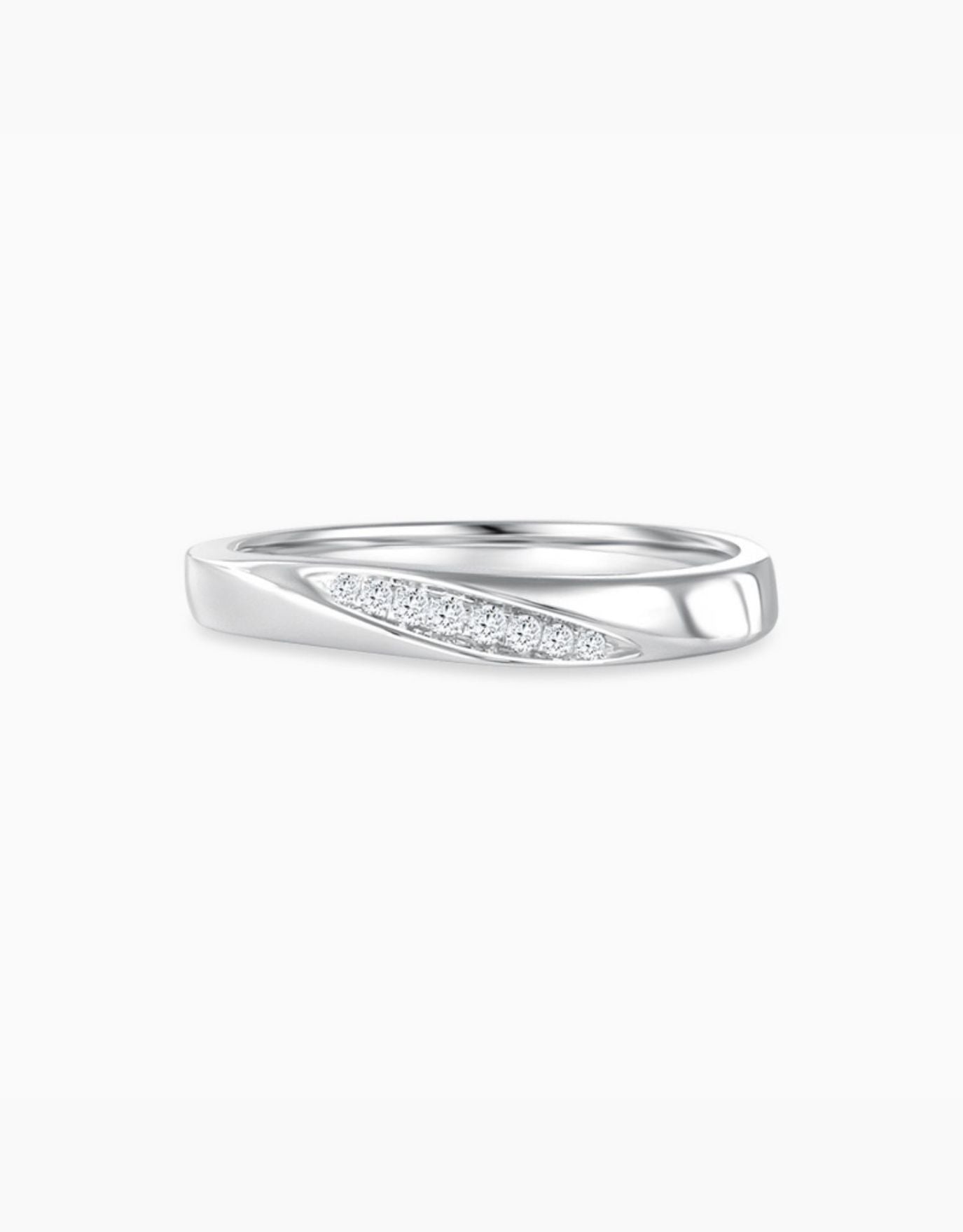 LVC wedding band designed with a leaning row of round diamonds for everyday wear