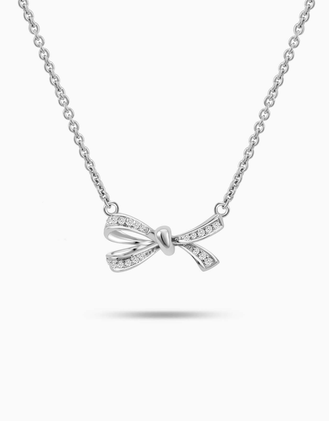 LVC necklace designed with a diamond-studded bow in white gold