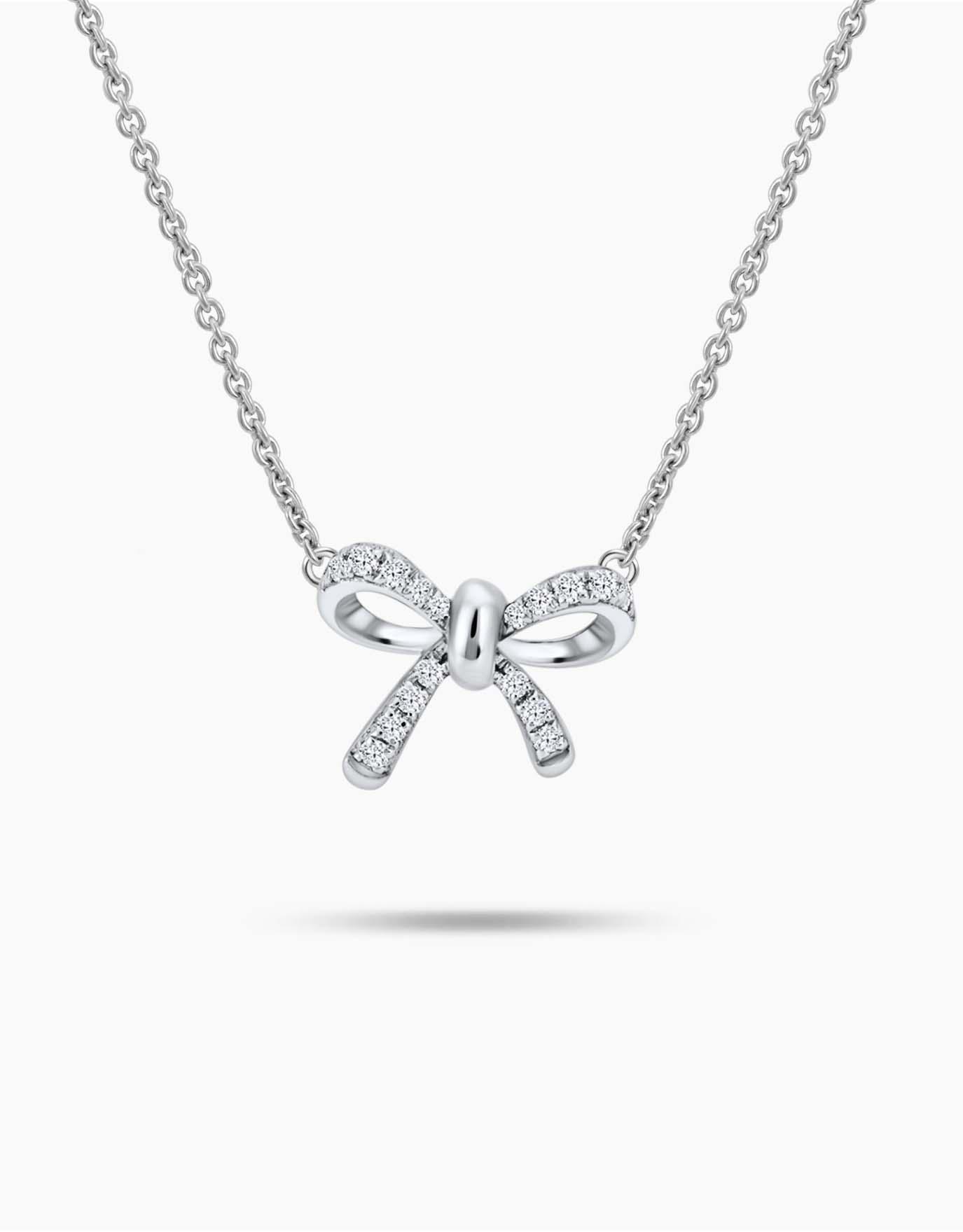 LVC necklace designed with a bow encrusted with diamonds in white gold