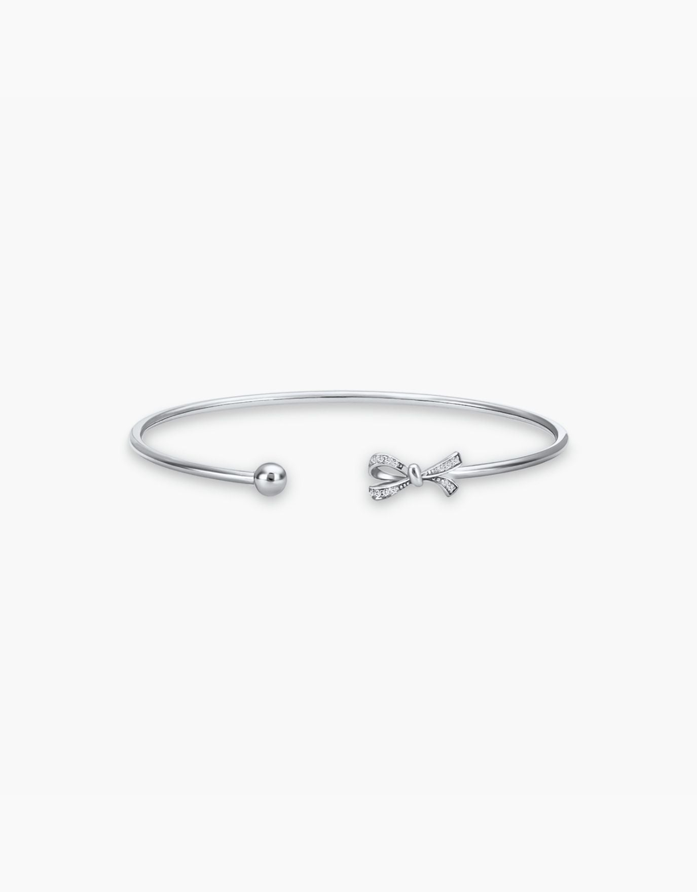 LVC diamond bangle designed with the signature bow in white gold