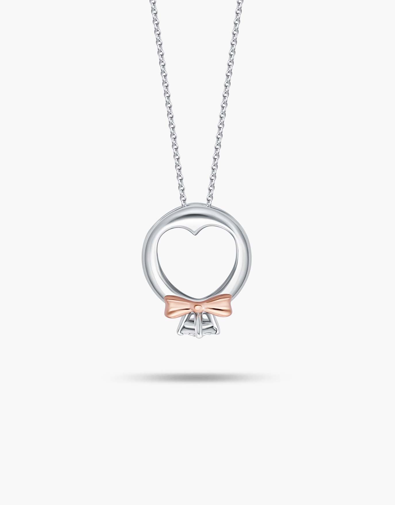 LVC necklace in white gold with Mini Ring Diamond Pendant features a unique heart-shaped band with rose gold accents added to the bow 