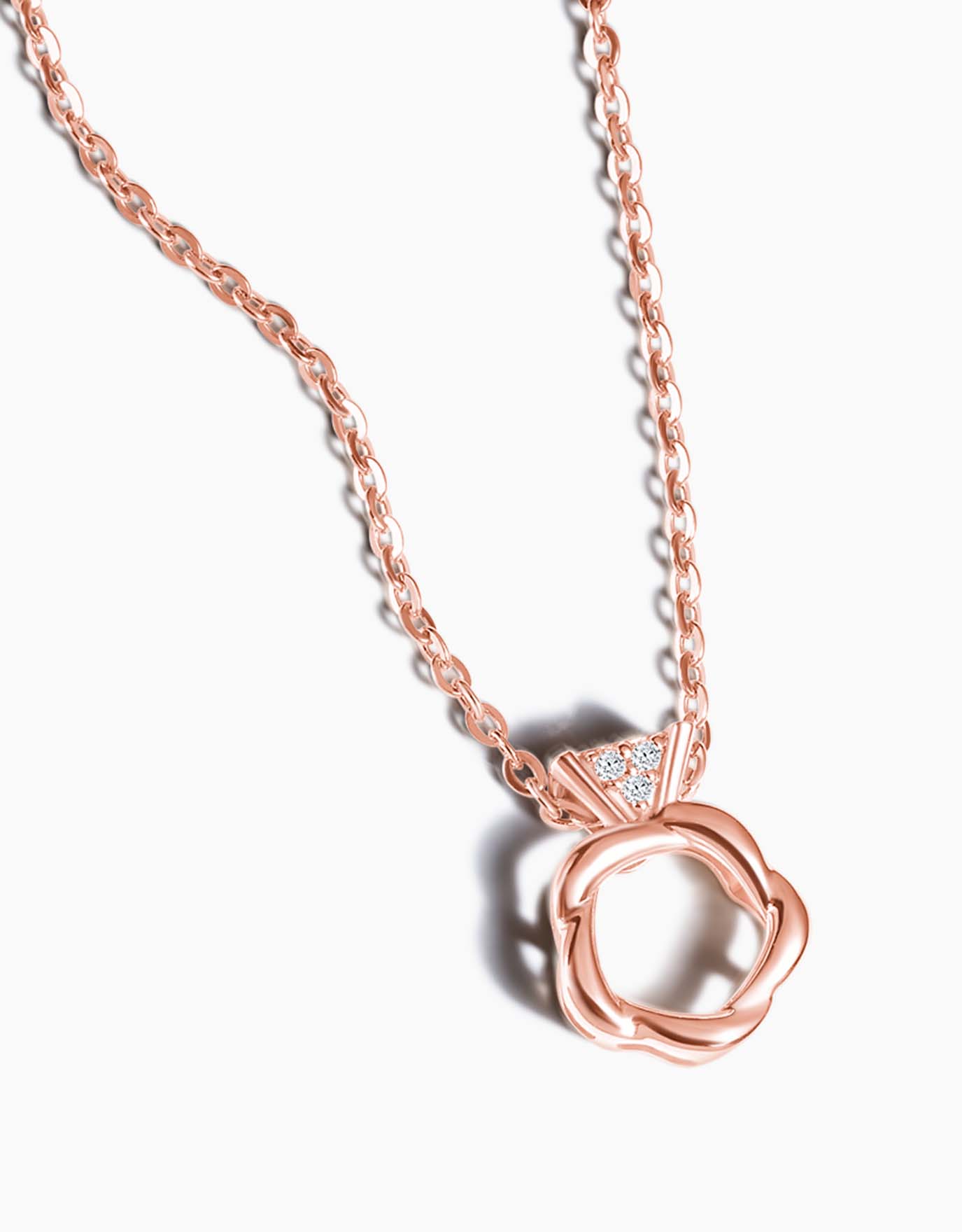 LVC necklace with Mini Ring Diamond Pendant features a rose gold ring with the design of the band shaped similarly to a rose in rose gold