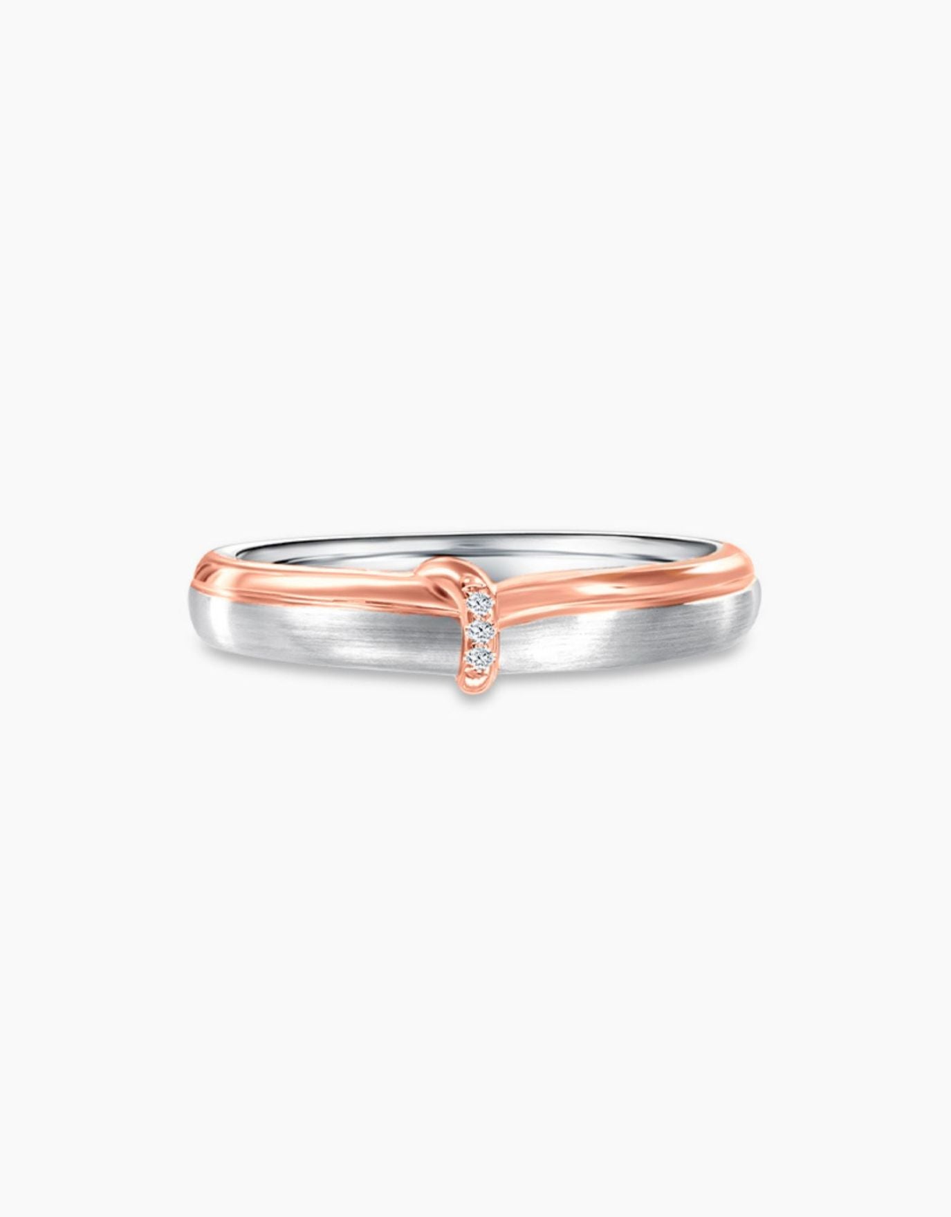 LVC wedding band designed with a dainty rose gold knot resting on a white gold ring completed with three diamonds 