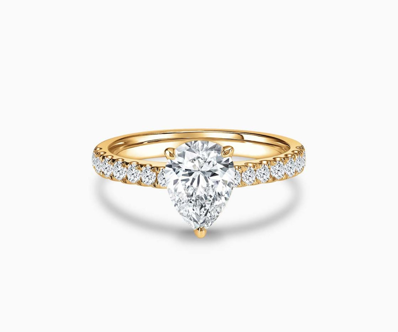 LVC solitaire ring with classic straight band lined with side diamonds and a diamond on the centre in yellow gold