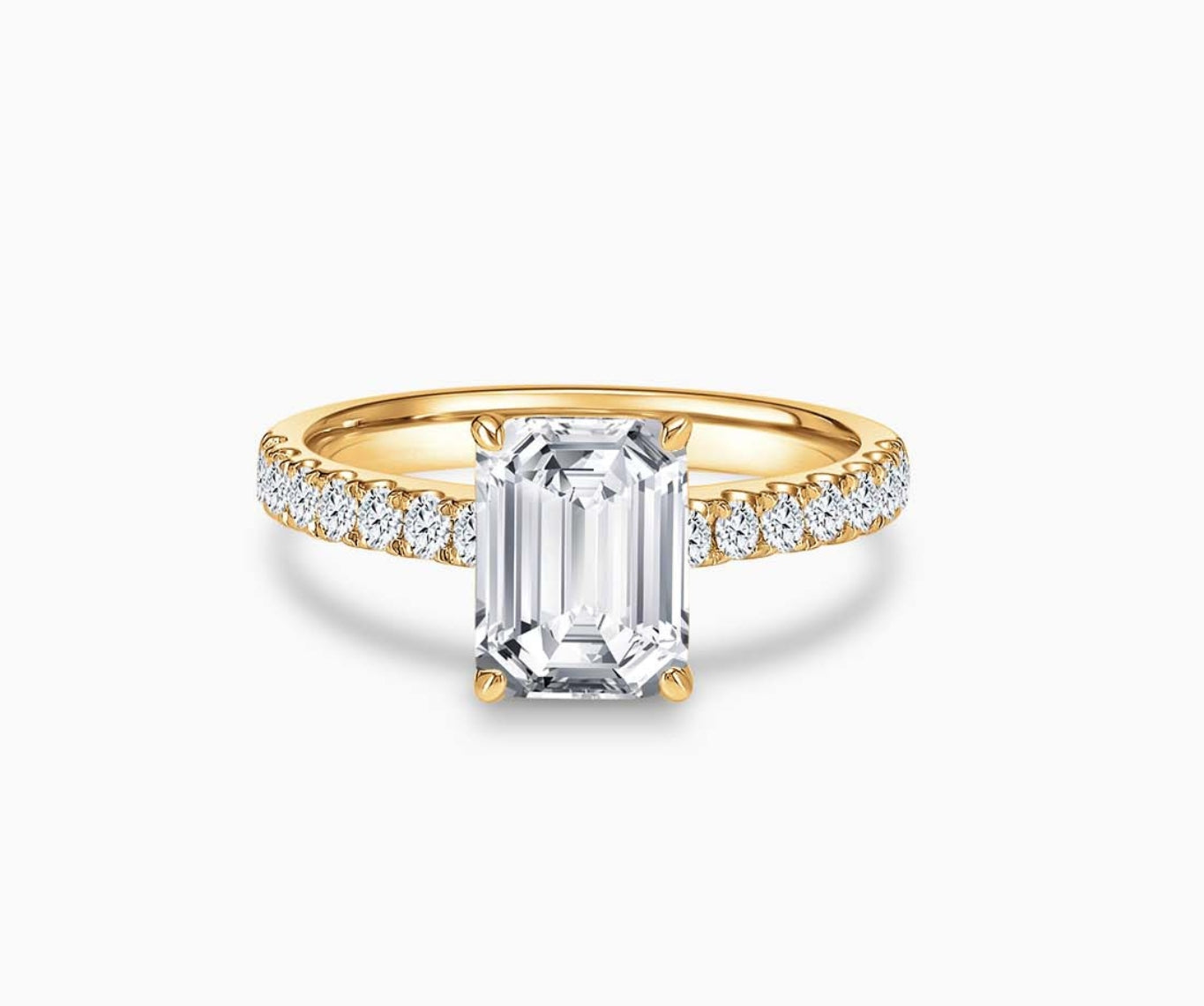 LVC solitaire ring with classic straight band lined with side diamonds and a diamond on the centre in yellow gold