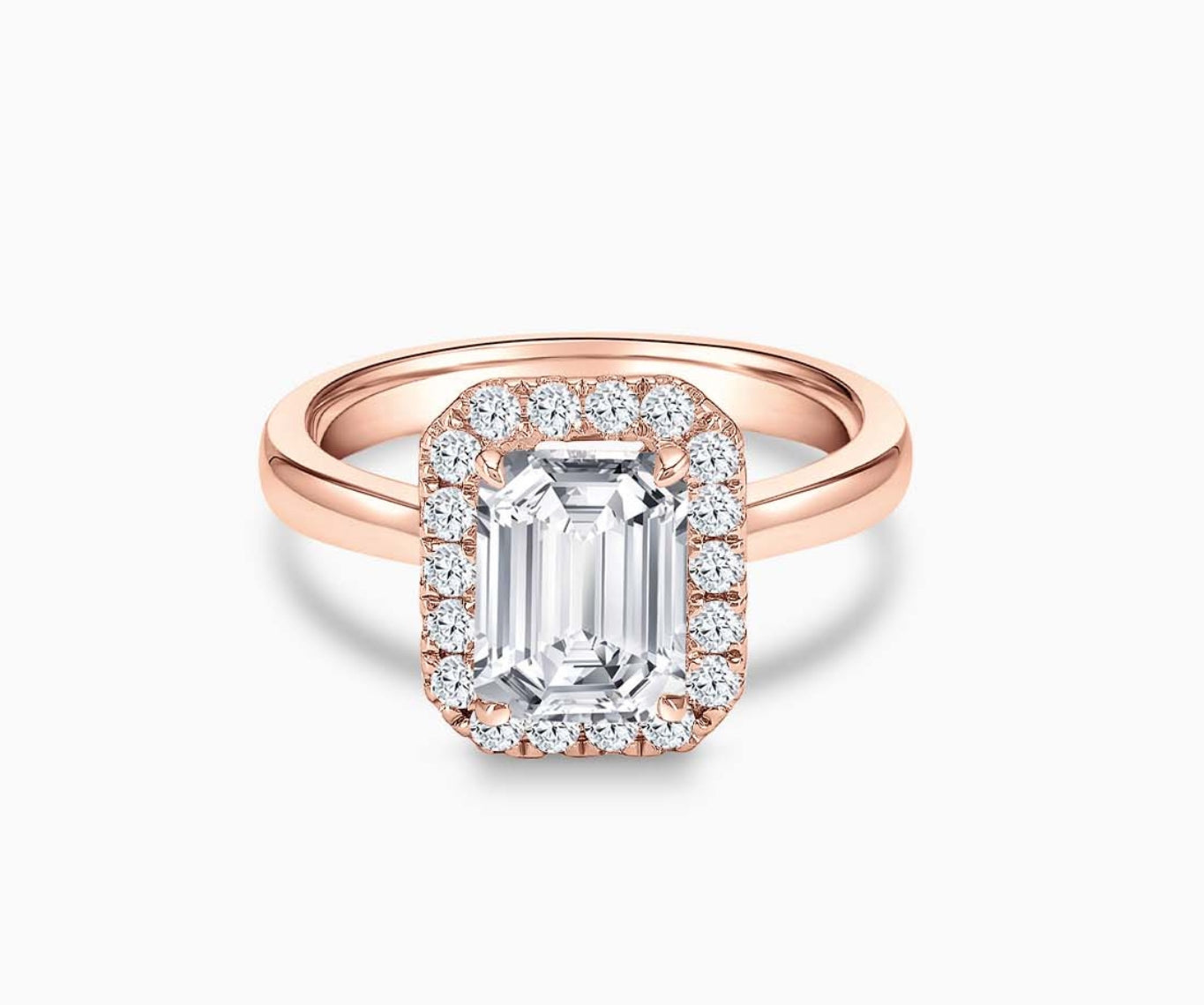 emerald cut diamond halo engagement ring set in rose gold with straight plain band design