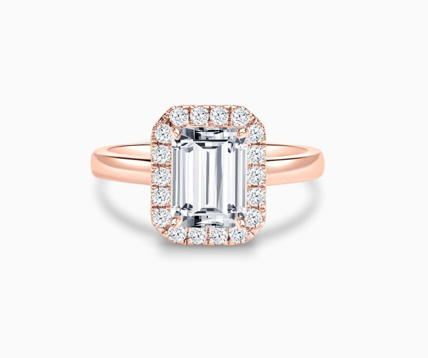 emerald cut diamond halo engagement ring set in rose gold with straight plain band design