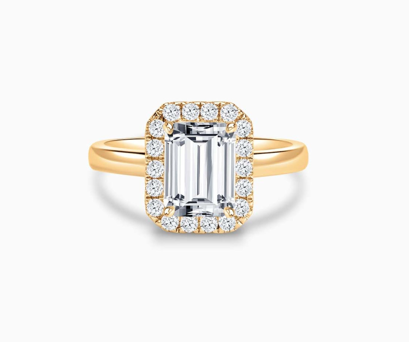 Emerald cut diamond halo engagement ring set on yellow gold with a straight plain band design