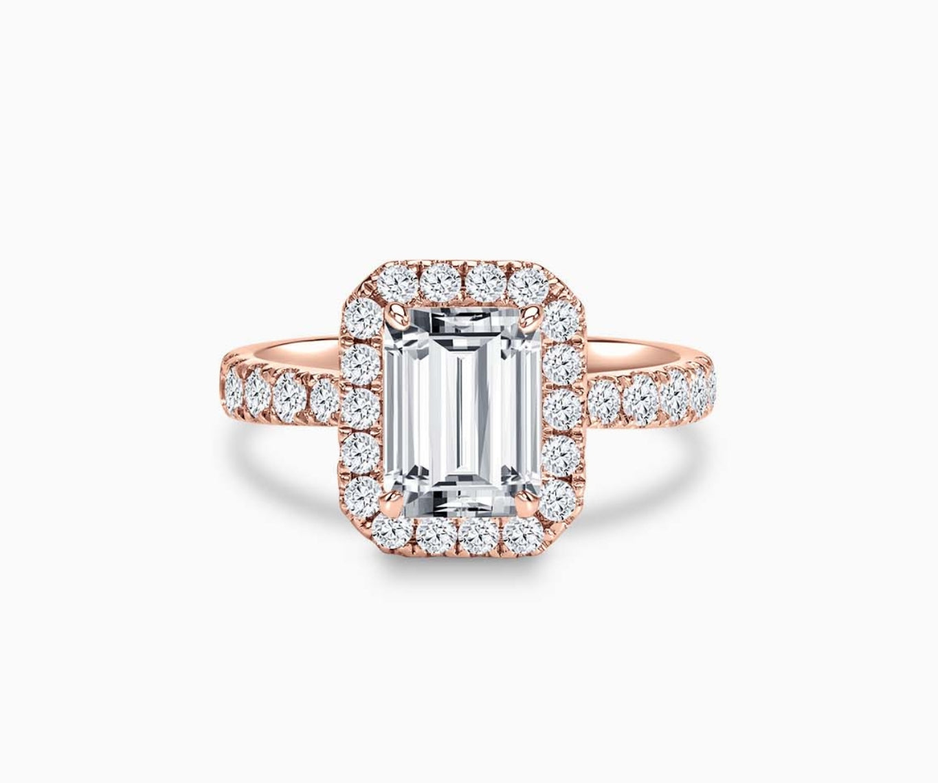 emerald cut diamond halo engagement ring set in rose gold with tapered pave band design