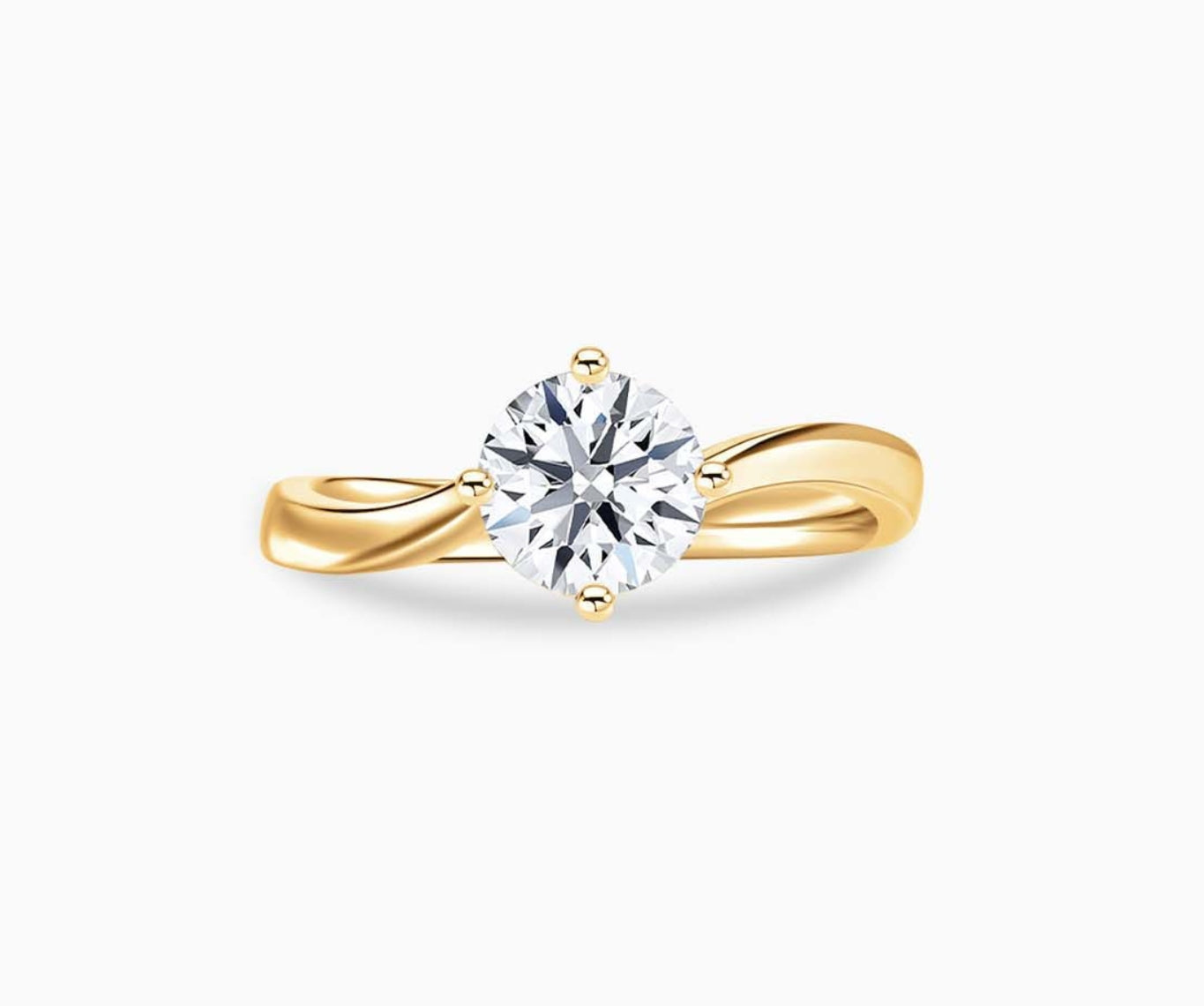 Yellow gold solitaire diamond ring with a sleek twirl band, blending vintage charm with modern elegance to highlight the center stone