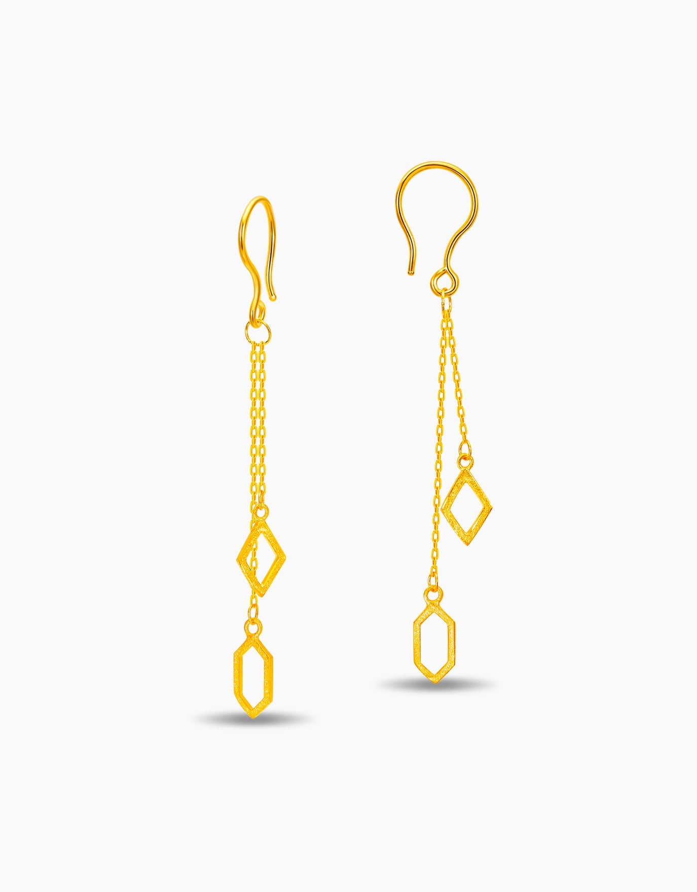 LVC dangling earrings in 999 gold with geometric designs