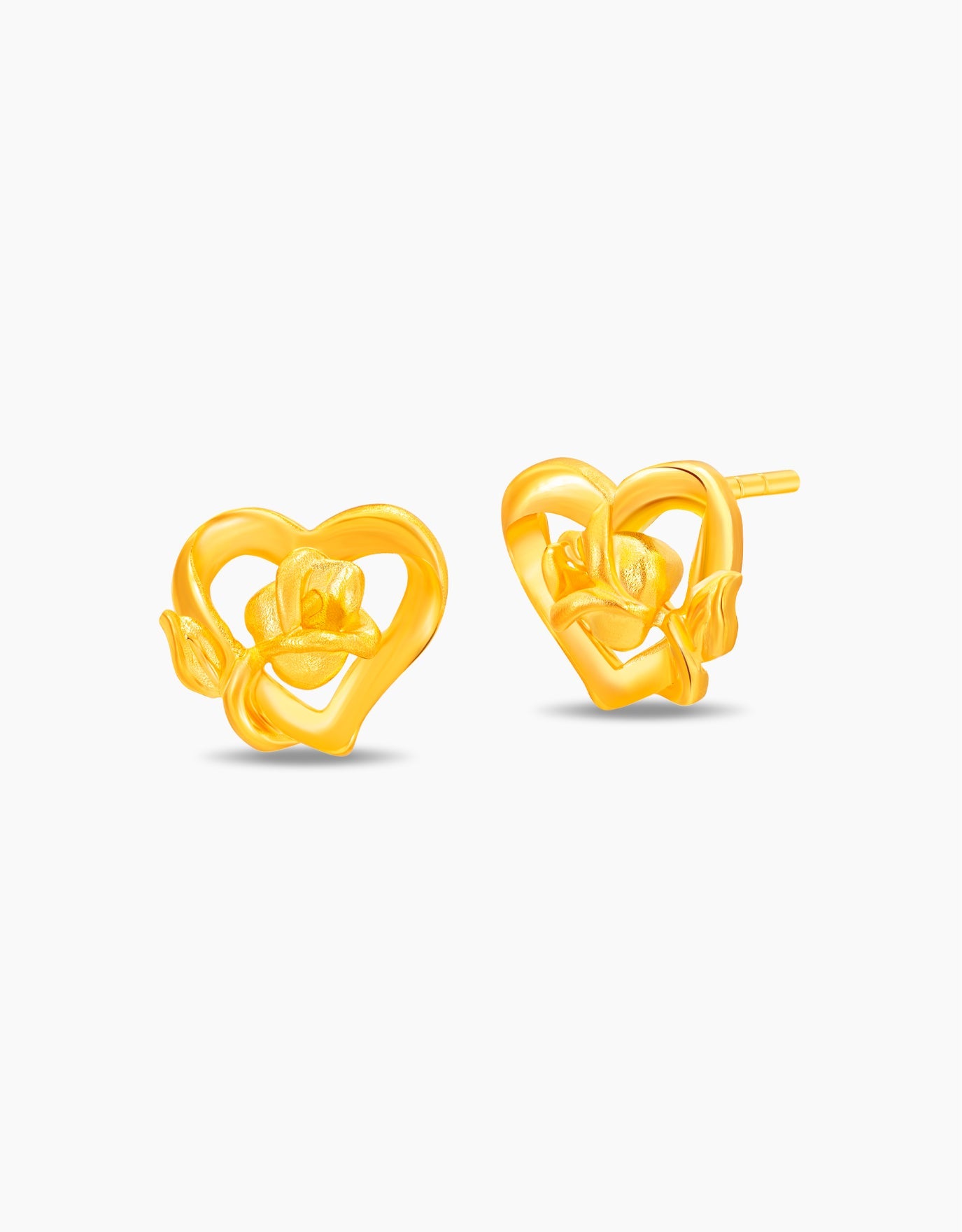 LVC stud earrings in 999 pure gold with a rose nestled in a heart shaped frame