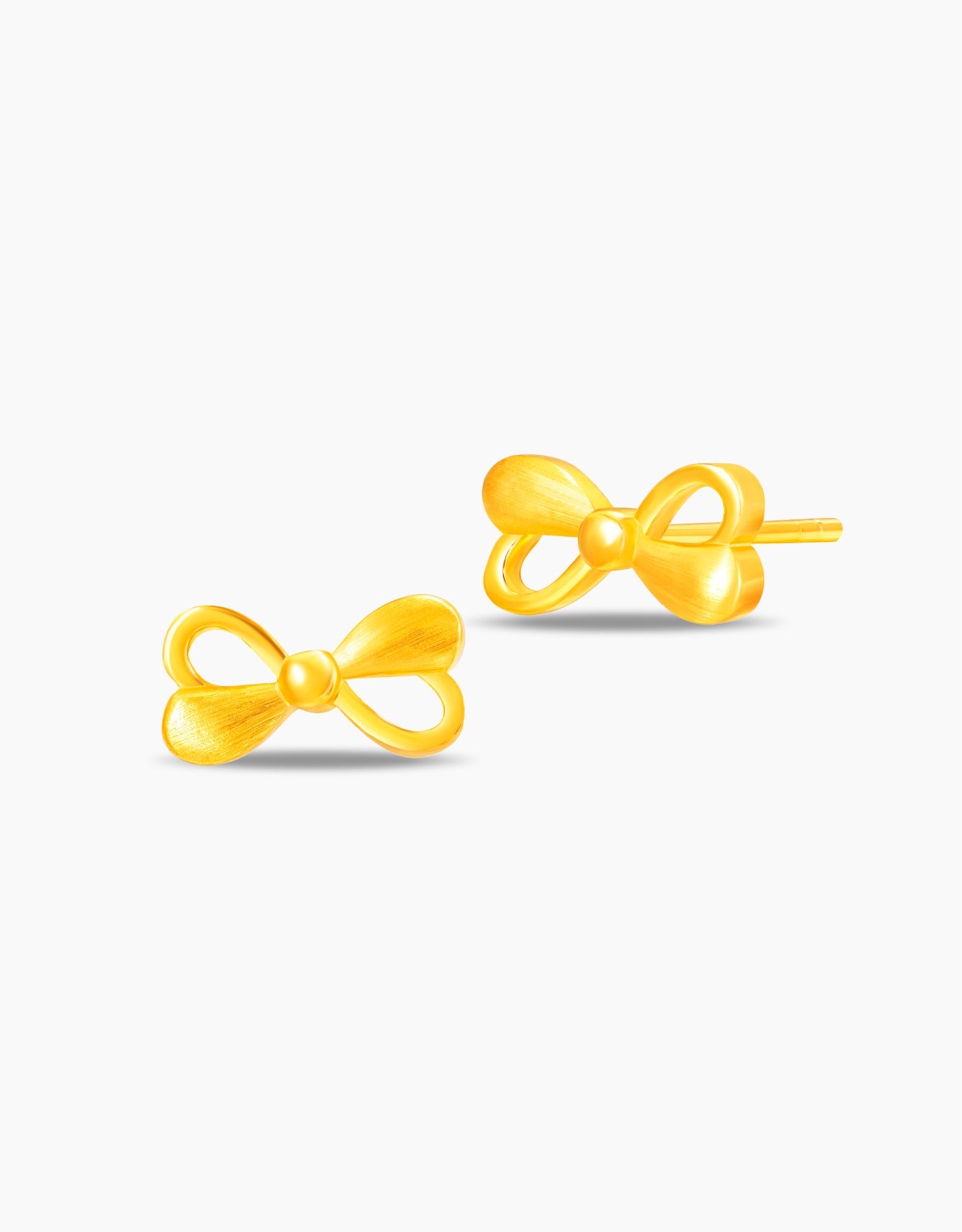 LVC stud earrings in 999 gold with bow design