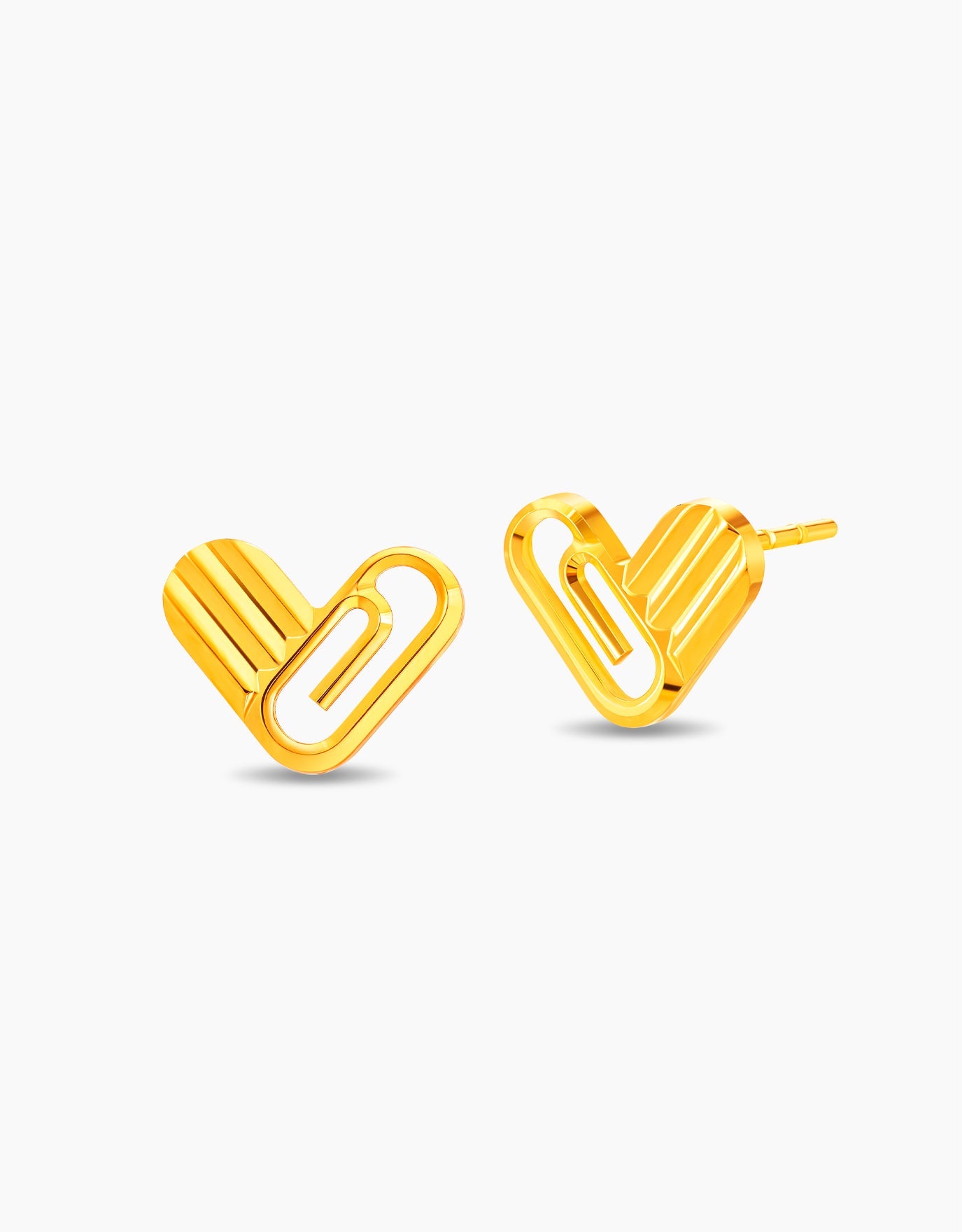 LVC stud earrings in 999 gold with a paper clip inspired heart design