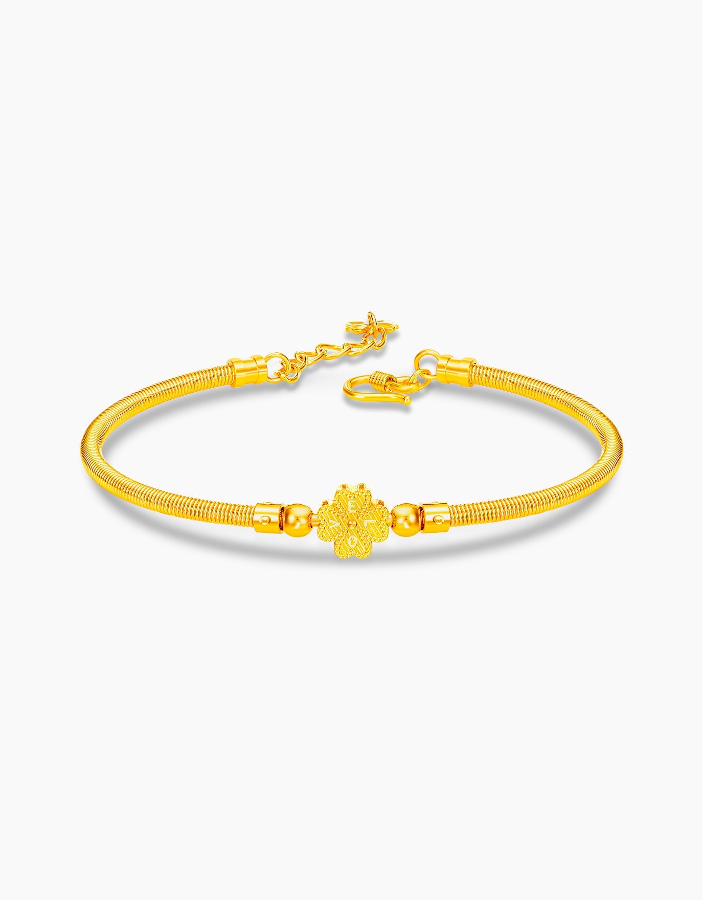 LVC bangle bracelet in 999 gold with clover flower design in the centre