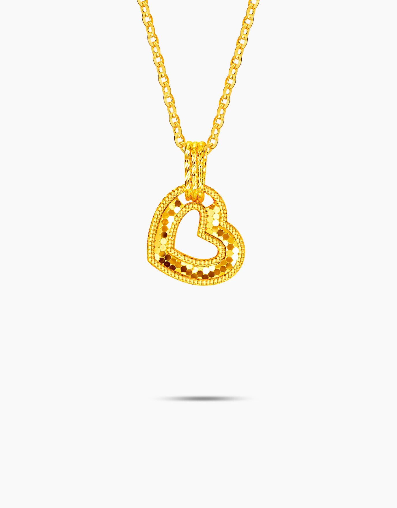 LVC necklace in 999 gold  features a radiant heart pendant 