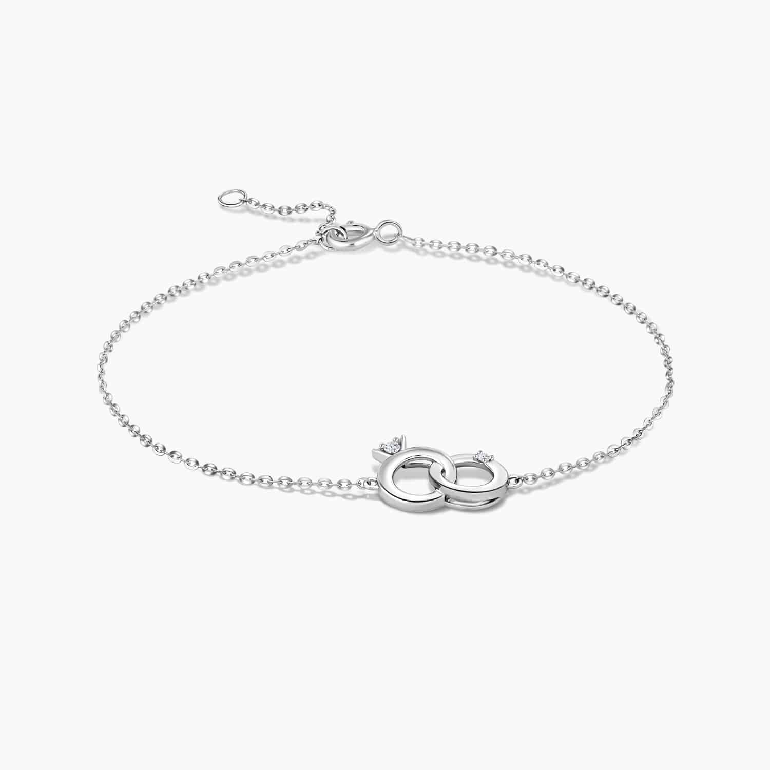 LVC BRACELETS CHARMES MODERN MINI RING features two interlocking mini rings consists of two diamonds in 14k white gold